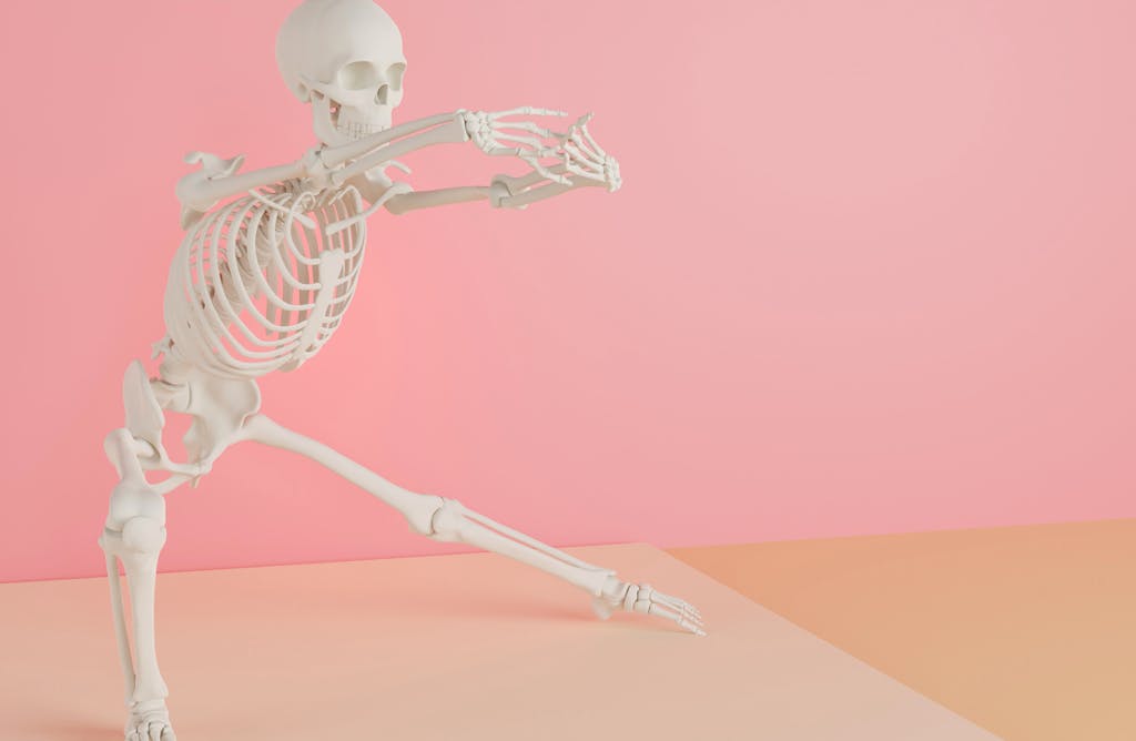 Skeleton in Front of Pink Wall