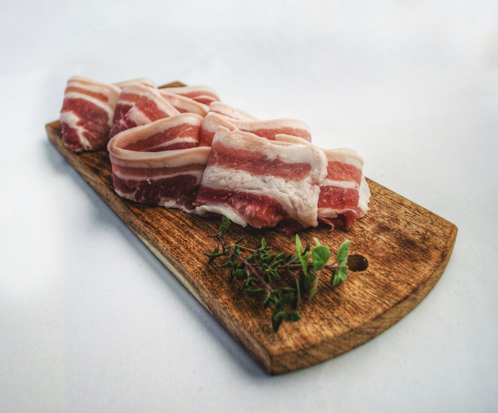 Photo by Nicolas Postiglioni Food Photography of Sliced Bacon on Top of Brown Chopping Board -Testosterone Levels