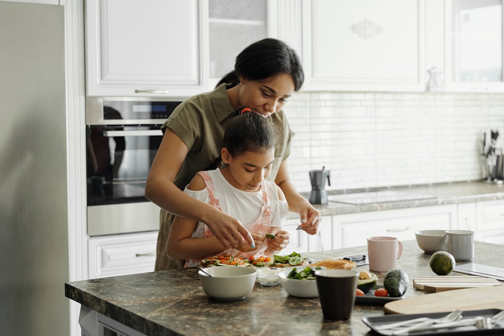 Mother and Daughter Preparing Avocado Toast